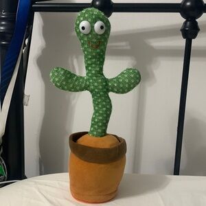 A green cactus that copies your voice in bight pitch, the music does not work
